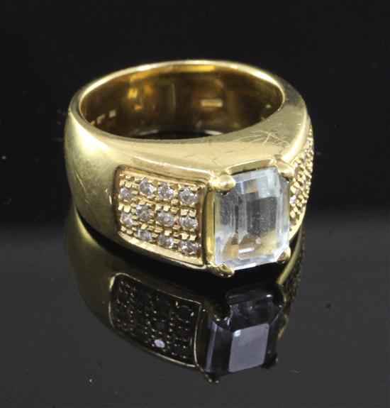 A modern 18ct gold and single stone aquamarine dress ring, size I.